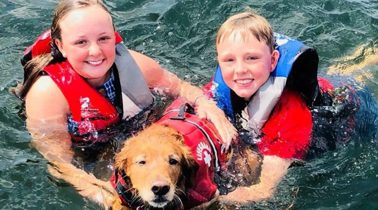 Kids in the Water with a dog