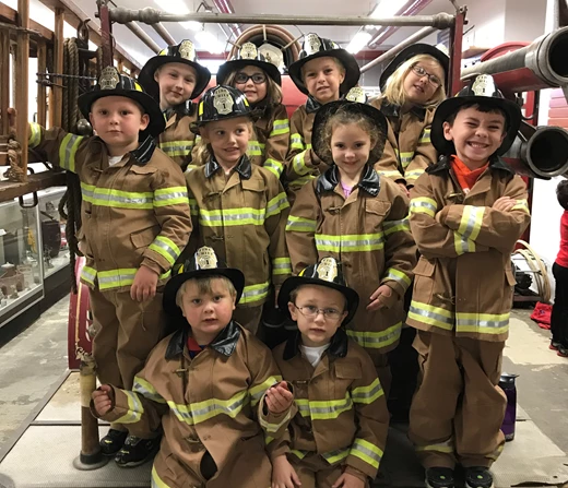 Kids dressed as firefighters