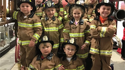 Kids dressed as firefighters